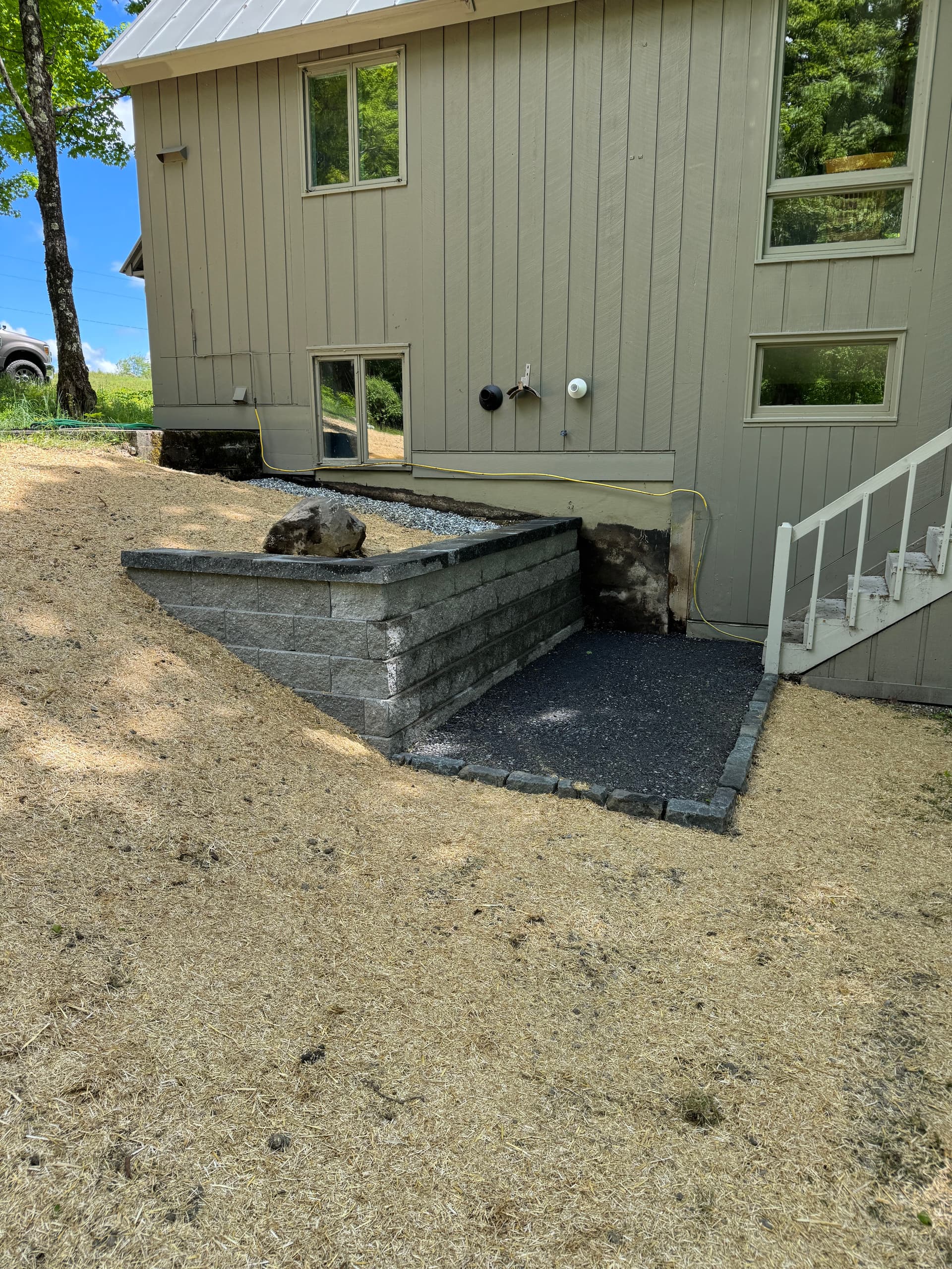 Failing Wood Retaining Wall Replaced With Engineered Block and French Drain image