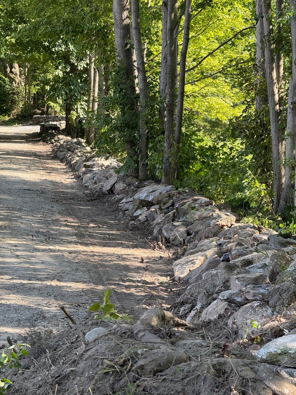 Gallery photos for Revitalized Rock Wall Along a Community Road in Dorset: Image #1